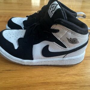 Kids Black and White Nike Sneakers